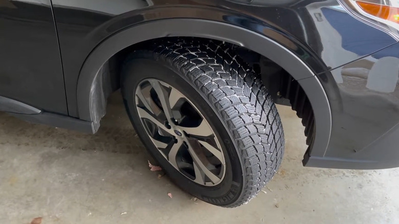A Michelin X-Ice Snow tire on a Subaru