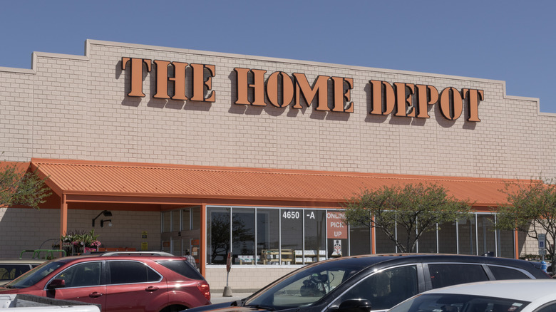 Cars parked outside a Home Depot during the day