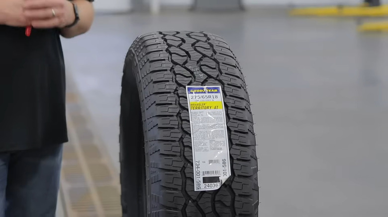 A Goodyear Wrangler Territory AT tire on display