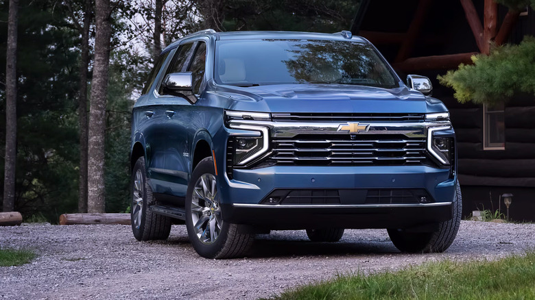 A blue Chevrolet Tahoe parked