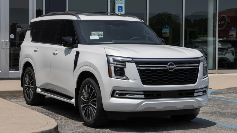 A white Nissan Armada parked at a dealership