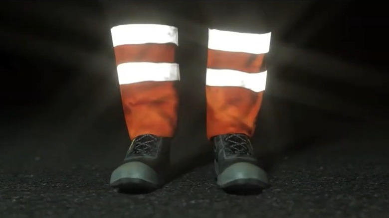 Close-up of a person wearing Scotchlite reflective material on their shins