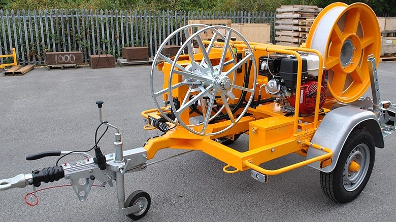 A pull and assist winch parked outdoors.