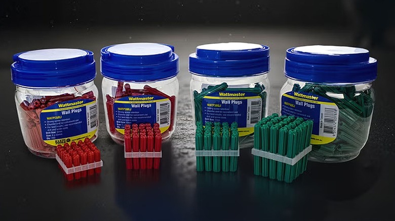 Jars of Wattmaster insulation tapes in red and green colors.