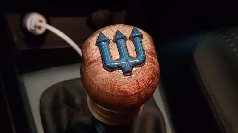 3D printed trident design shift knob in a car