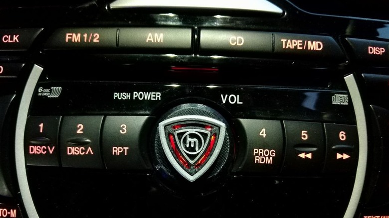 3D printed Rotary Rotor Volume Knob For Mazda RX8 Radio attached to radio