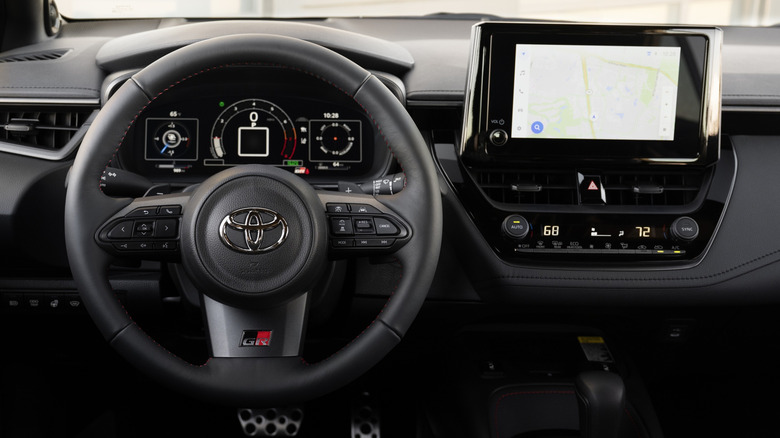 Close shot of 2026 Toyota GR Corolla interior, showing instrument panel and central touchscreen