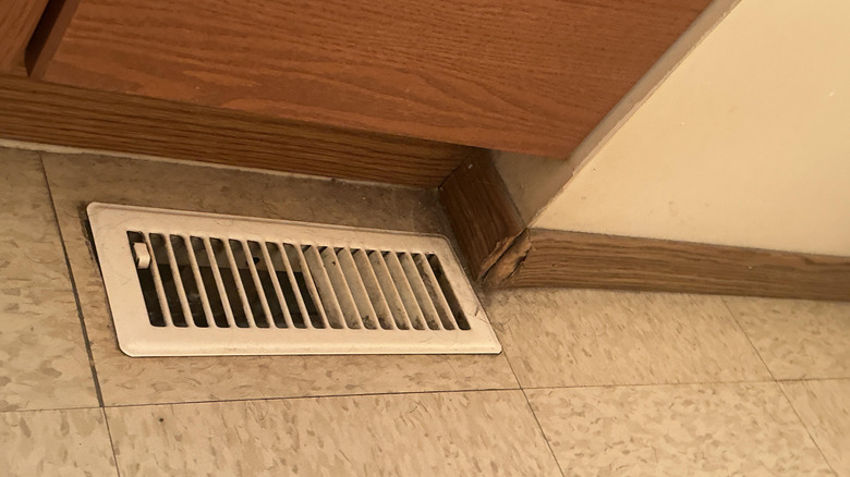 HVAC floor register vent inside a house
