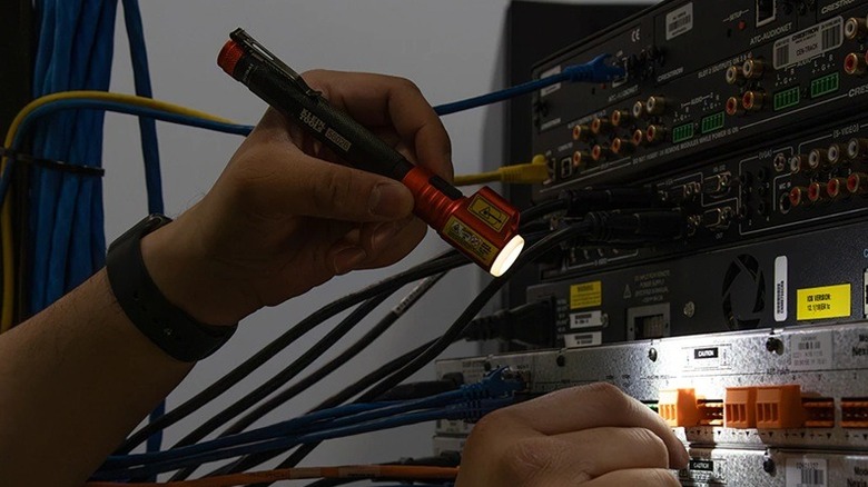 Person using inspection penlight