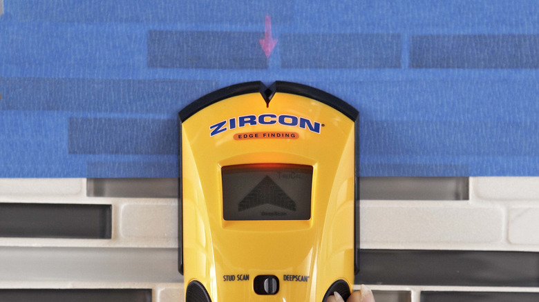 Person using Zircon stud finder