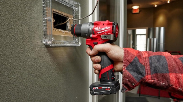 doing electrical work with Milwaukee drill