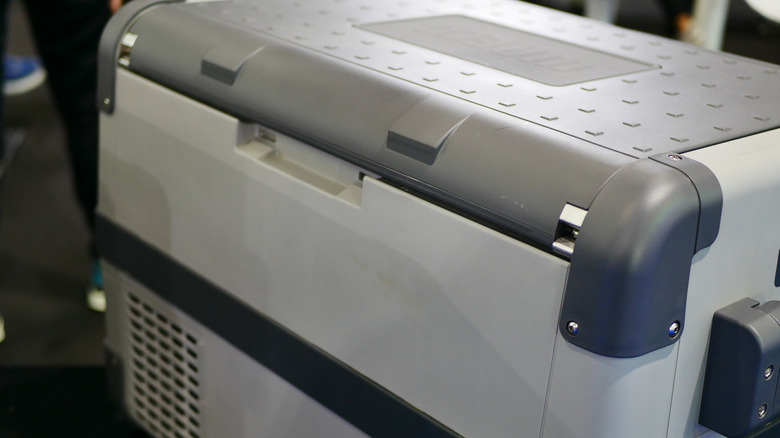 Closeup of a black and gray cooler