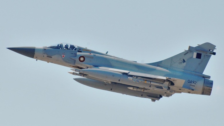 A Dassault Mirage 2000 flying over grey skies