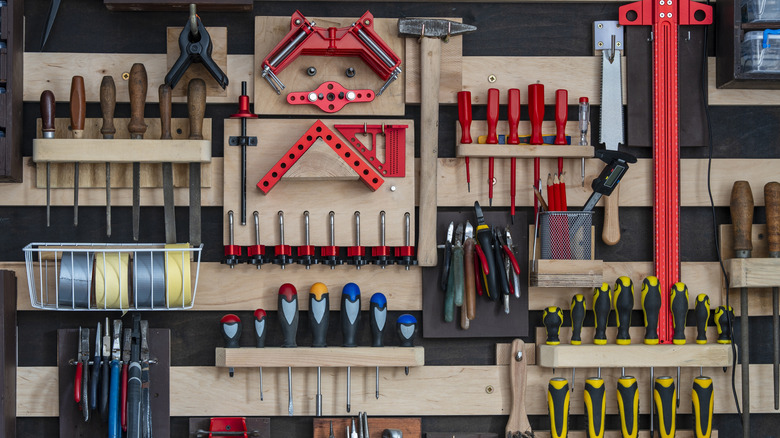 Tools hanging on a French cleat system