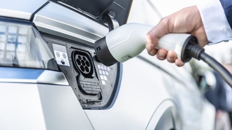 Charger being plugged into vehicle