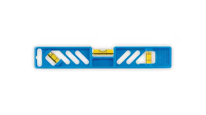 A blue torpedo level with three yellow vials