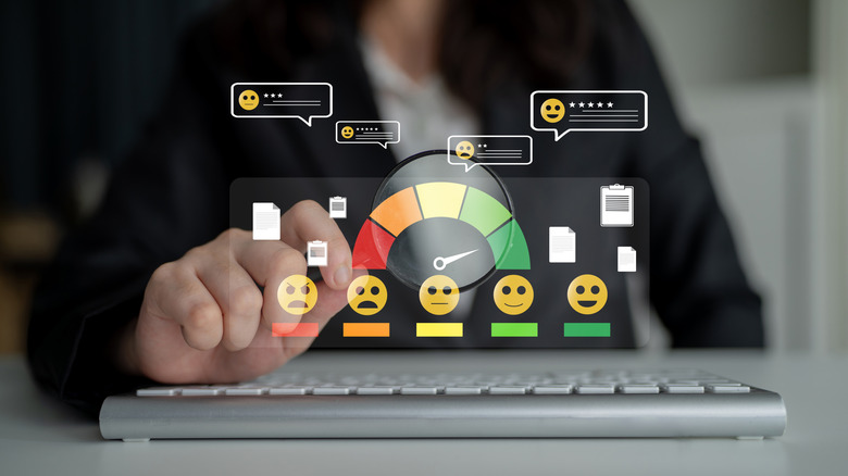 Holographic icons of customer feedback, from happy to sad emojis