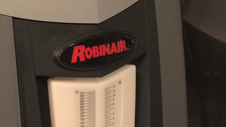 A Robinair badge on an automotive recovery machine