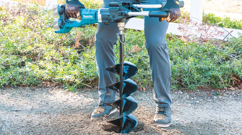 Cordless Earth Auger in use