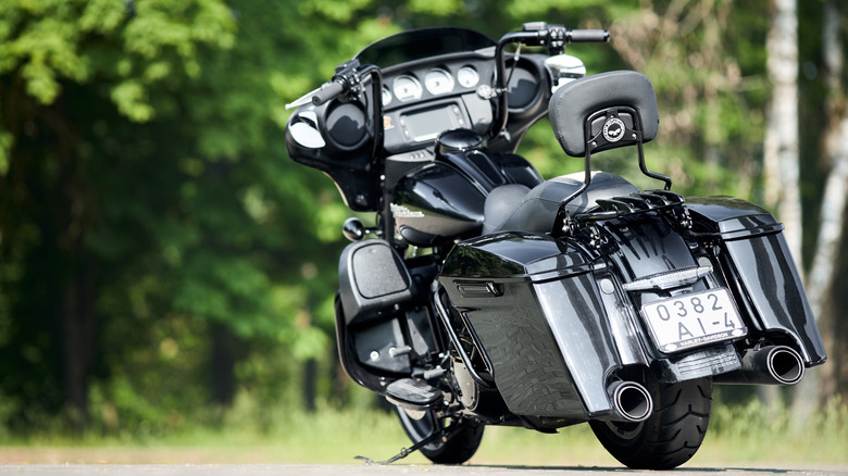 A silver Harley-Davidson Street Glide equipped with the 103 Twin Cam engine parked on its kickstand outside.