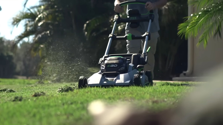 A POWER+ Mower 30" Super Composite Deck with Dual Motors being used to cut a lawn