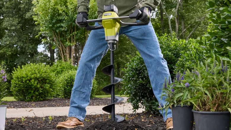 Man using a Ryobi PBLAUG01K Auger