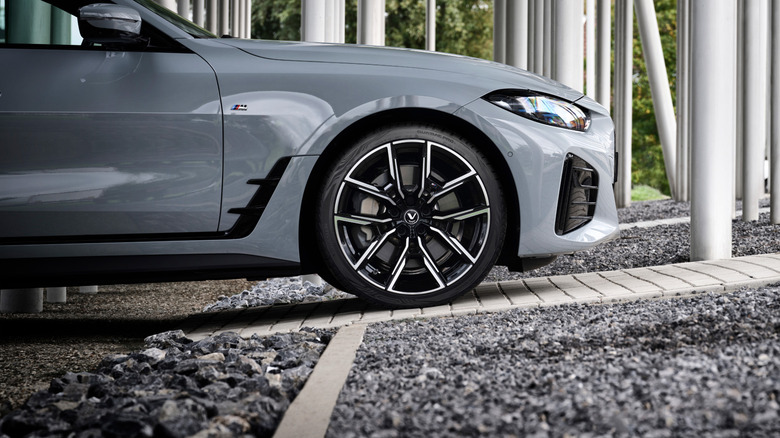 A gray car with Vredestein tires on it