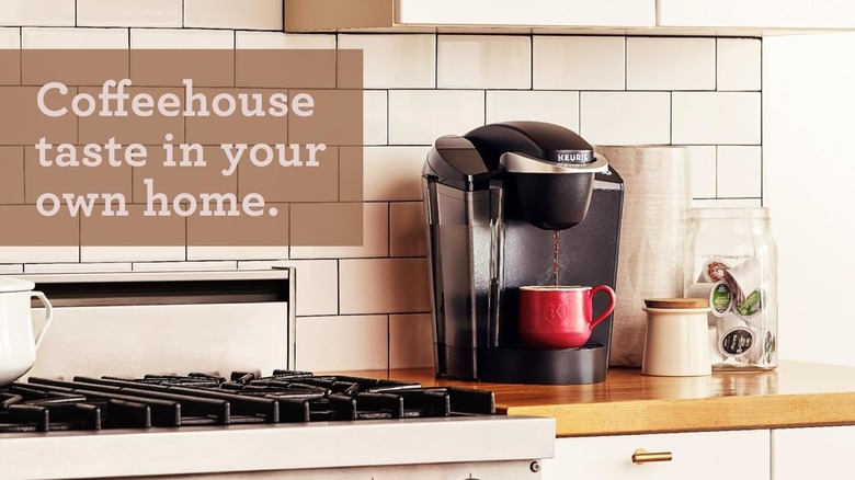 K-Classic coffee maker on a counter, next to the words "Coffeehouse taste in your own home."