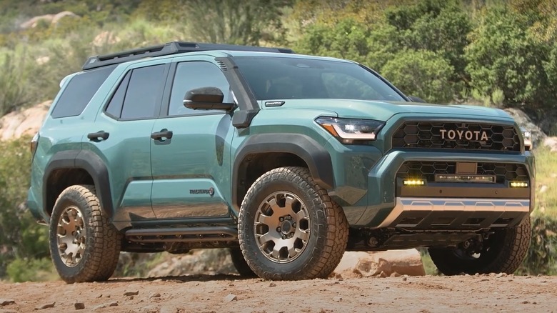 Toyota 4Runner in Everest color against a scenic forest landscape