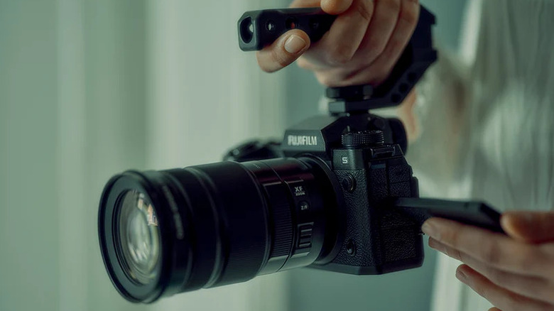 A person shooting content with the Fujifilm X-H2S