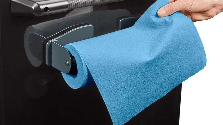 A U.S. General magnetic paper towel holder on the side of a toolbox.