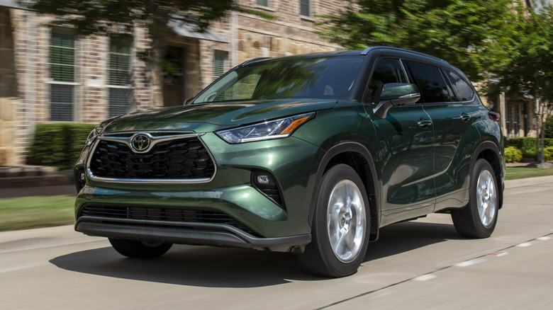 2025 Toyota Highlander on a suburban road