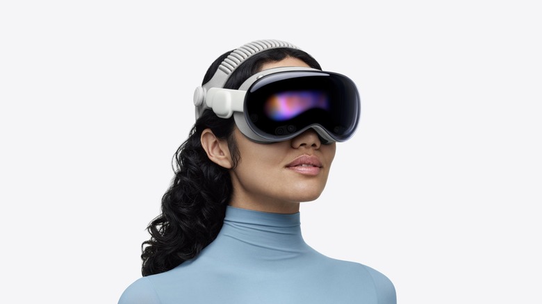 A woman wearing an Apple Vision Pro headset