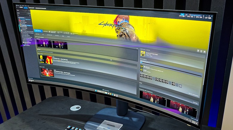 the Alienware AW3926QW gaming monitor showing the Cyberpunk 2077 Steam page