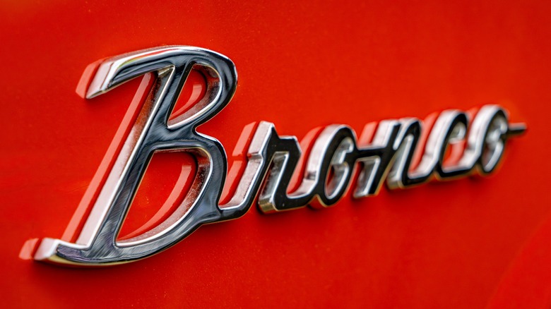 Ford Bronco insignia on red truck