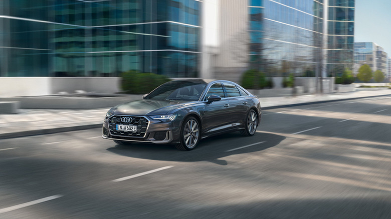 Audi A6 zipping through a city road