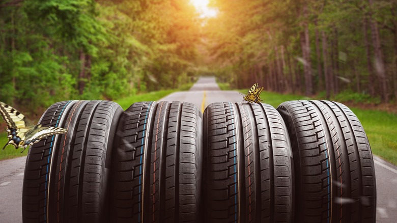 four car tires lined in a row