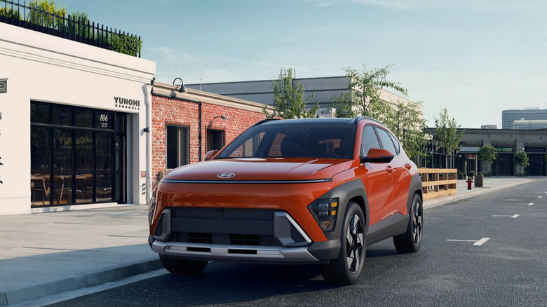 A 2026 Hyundai Kona parked by a group of stores