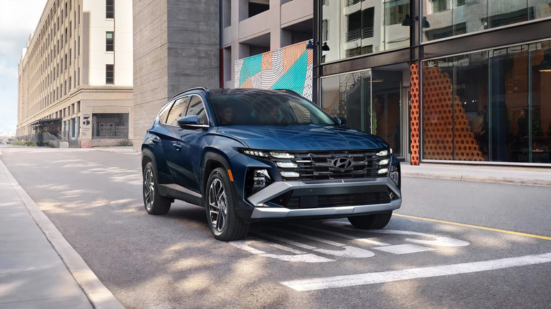 An ultramarine 2026 Hyundai Tucson paused at a stop sign