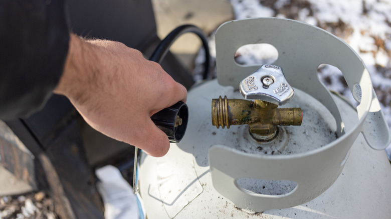 Person using a propane tank