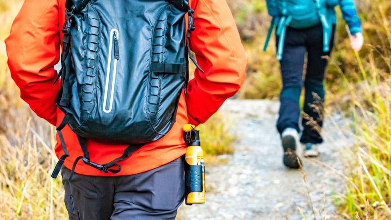 Person wearing bear mace on holster
