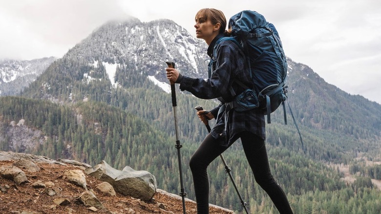 Person hiking with trekking poles