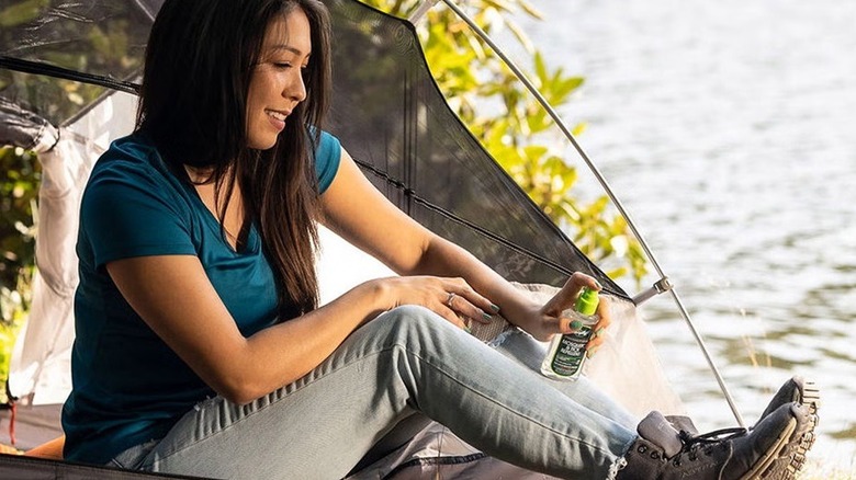 Person using Murphy's Naturals insect spray