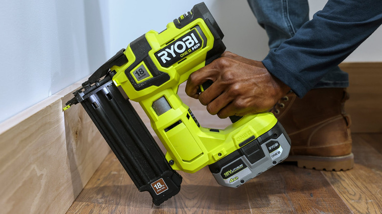 The 18V One+ HP Brushless Airstrike 18ga Brad Nailer used on a skirting board.