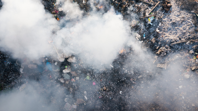 trash dumpster garbage fire smoke