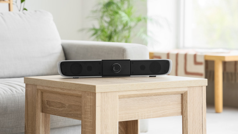 A wireless speaker on a coffee table.