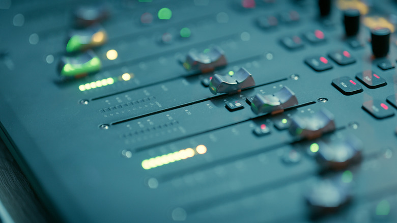 A series of dials on a mixing desk.