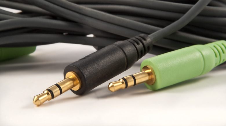 Two 3.5mm aux jacks, one green and one black.