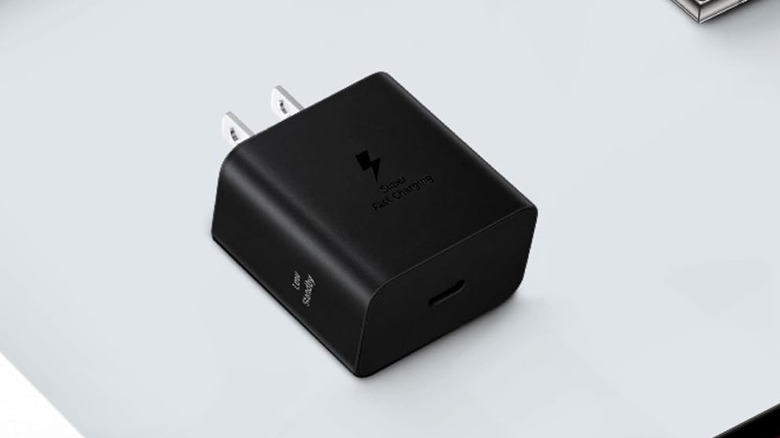 A Samsung charging brick on a gray table.