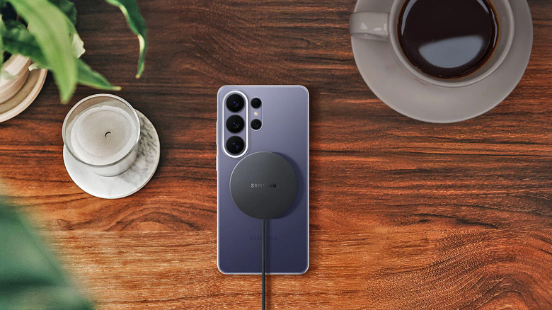 A Samsung Galaxy phone with a magnetic charger on the back.